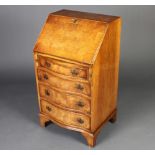 A Queen Anne style figured walnut and crossbanded bureau with fall front above a bow front base