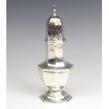 An octagonal silver shaker of plain form Birmingham 1927, 21cm, 176 grams