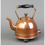 An early copper electric kettle with turned wooden handle