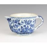 A 19th Century Chinese blue and white teapot decorated with panels of flowers 8.5cm The body is