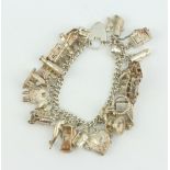 A silver charm bracelet 83 grams