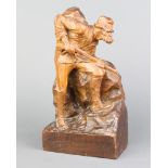 A carved wooden figure of a huntsman with gun, base marked Cortinas Fimpezzo 1925 25cm h 14cm w x
