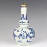 A 19th Century Chinese bottle vase decorated with a dragon chasing the flaming pearl, having a white