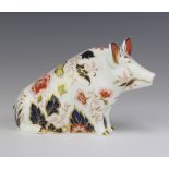 A Royal Crown Derby Imari pattern paperweight of a sitting pig with gold stopper 11cm