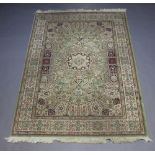 A green and white ground Belgian cotton Persian style rug with central medallion 227cm x 160cm