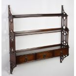 A pair of Georgian style mahogany 3 tier wall shelves with pierced panels to the side, the base