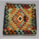 A tan, white and black ground Chobi Kilim with diamond medallion to the centre 54cm x 49cm