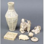 A 19th Century carved Cantonese ivory puzzle contained in a square box decorated with figures in a