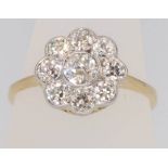 An 18ct yellow gold diamond cluster ring, approx. 1ct, size P