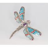 A silver marcasite, enamelled and amethyst dragonfly brooch