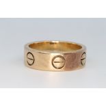 A gentleman's 9ct yellow gold Cartier style ring, size T, 8.7 grams
