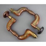 Two 19th Century unmarked mahogany and brass braces