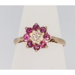 A 9ct yellow gold ruby and diamond cluster ring size M 1.9 grams