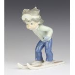 A Lladro group of a boy skier - Sport Billy 19.5cm