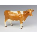 A Beswick Guernsey cow 1248A, gold brown and white gloss, 10.8cm