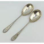 A pair of Victorian silver chased serving spoons London 1897, 195 grams