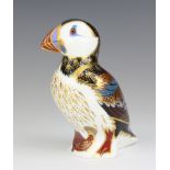 A Royal Crown Derby Imari pattern paperweight of a puffin with silver stopper 12cm