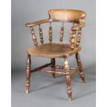 An elm smokers bow chair, raised on turned supports with double H framed stretcher Frame is loose