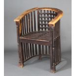 A 1920's Liberty style hardwood stick and tub back chair This chair requires some attention