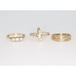 Three 9ct yellow gold diamond rings size N