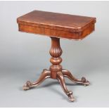A Victorian mahogany D shaped card table of small proportions raised on a bulbous turned and