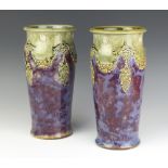 A pair of Royal Doulton oviform vases decorated with fruits and leaves 30cm
