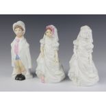 A Royal Worcester figure of a boy - Wedding Day 18cm, ditto of a girl 18cm and a white glazed