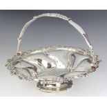 A George III silver swing handle basket with floral rim, London 1736, 496 grams, 25cm