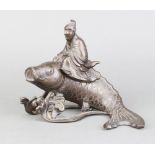 A Japanese bronze trinket box in the form of a carp being ridden by a seated gentleman 14cm x 19cm x