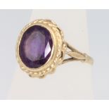 A 9ct yellow gold oval amethyst ring, size L, 3.2 grams