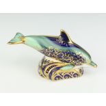 A Royal Crown Derby Imari pattern paperweight of a baby bottlenose dolphin with gold stopper 12cm