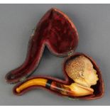 A Victorian carved Meerschaum pipe in the form of a gentleman cased The bowl is chipped