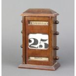 A Victorian perpetual calendar contained in a mahogany case 20cm x 14cm x 7cmSome sun bleaching