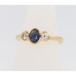 An 18ct yellow gold sapphire and diamond ring size L