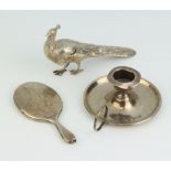 An Edwardian novelty miniature silver chamber stick Birmingham 1904, a ditto mirror Chester 1904 and