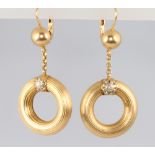 A pair of 18ct engine turned hoop earrings 6.3 grams