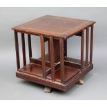 An Edwardian square inlaid mahogany table top revolving bookcase 35cm x 36cm x 36cm Scratch to the