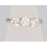 An 18ct white gold 3 stone brilliant cut diamond ring approx 1.54ct, size M