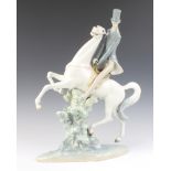 A Lladro figure of a gentleman on horseback 49cm The leather reign has perished but this figure is