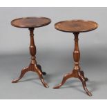 A pair of Georgian style circular mahogany wine tables, raised on a pillar and tripod base 54cm h