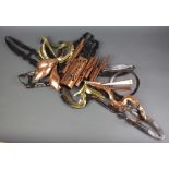 A pierced copper and iron wall sculpture 52cm x 127cm