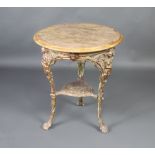A Victorian circular cast iron pub table raised on 3 outswept supports decorated Britannia with