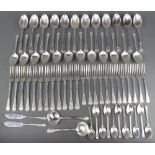 A canteen of Art Deco silver cutlery comprising 11 tea spoons, 12 dessert spoons, 12 table spoons, 2