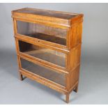 An oak 3 section Globe Wernicke style bookcase 106cm h x 86cm w x 28cm d Some light water marks to