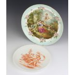 A Continental shallow dish decorated with woodland scene with shepherdess and angels 29cm, a sepia