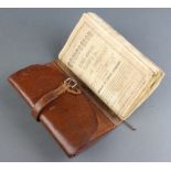 A Companion to Alfred Ronald's Fly Fishing Entomology, a leather fly fishing wallet containing