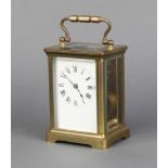A 19th Century French carriage timepiece with enamelled dial and Roman numerals contained in a