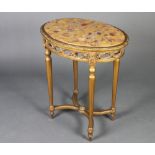 A Louis style pierced oval gilt wood occasional table with marble effect top, raised on turned and