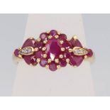 A 9ct yellow gold ruby and diamond cluster ring, size O, 2.7 grams