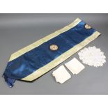 A Chinese blue and white dart shaped table runner with 3 embroidered roundels to the centre 32cm w x